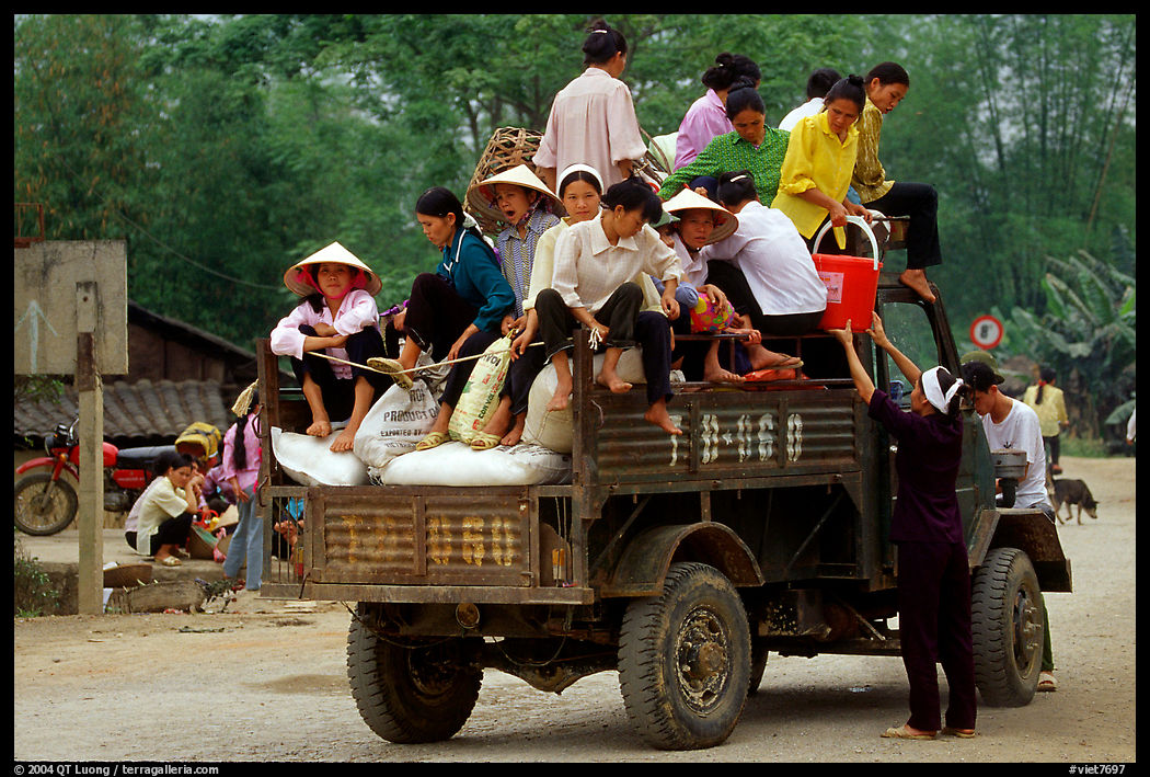 Riding in the back of an overloaded truck. Northest Vietnam