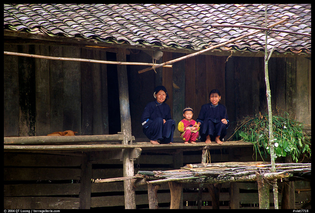 Women and child of the Nung ethnicity in front of their home. Northeast Vietnam