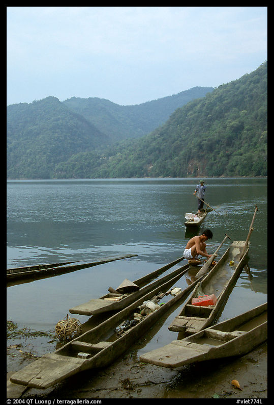 Typical dugout boats on the shore of Ba Be Lake. Northeast Vietnam