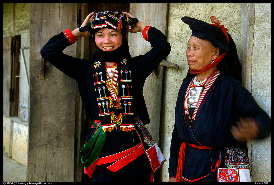 Two generations of tribewomen outside their house, near Mai Chau. Vietnam