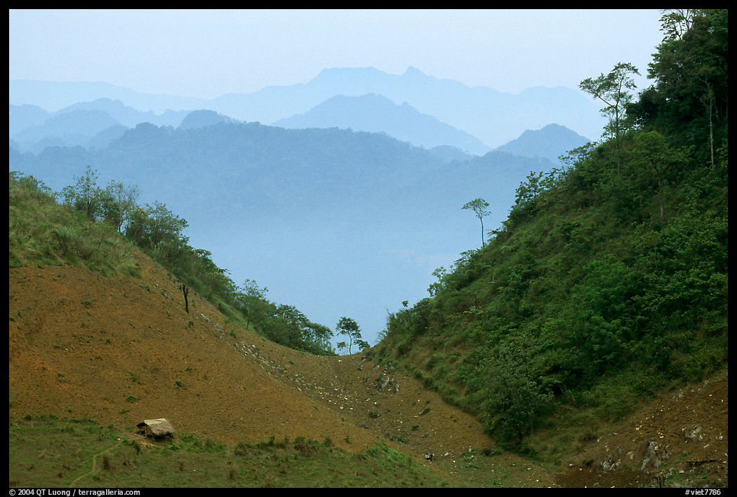 House and misty ridges between Moc Chau and Yeu Chau. Northwest Vietnam