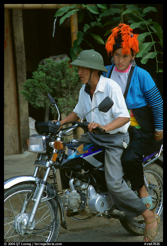 Dzao woman riding at the back of a motorbike, Tuan Giao. Northwest Vietnam