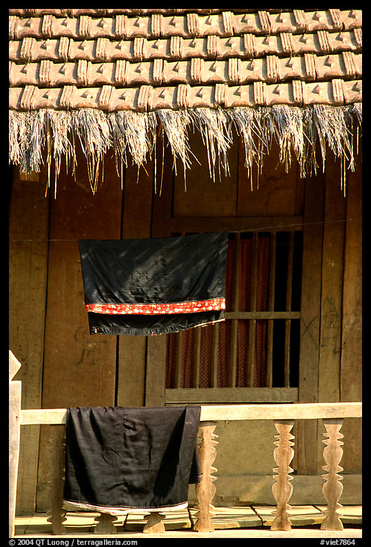Detail of hut with montagnard dress being dried, between Tuan Giao and Lai Chau. Northwest Vietnam