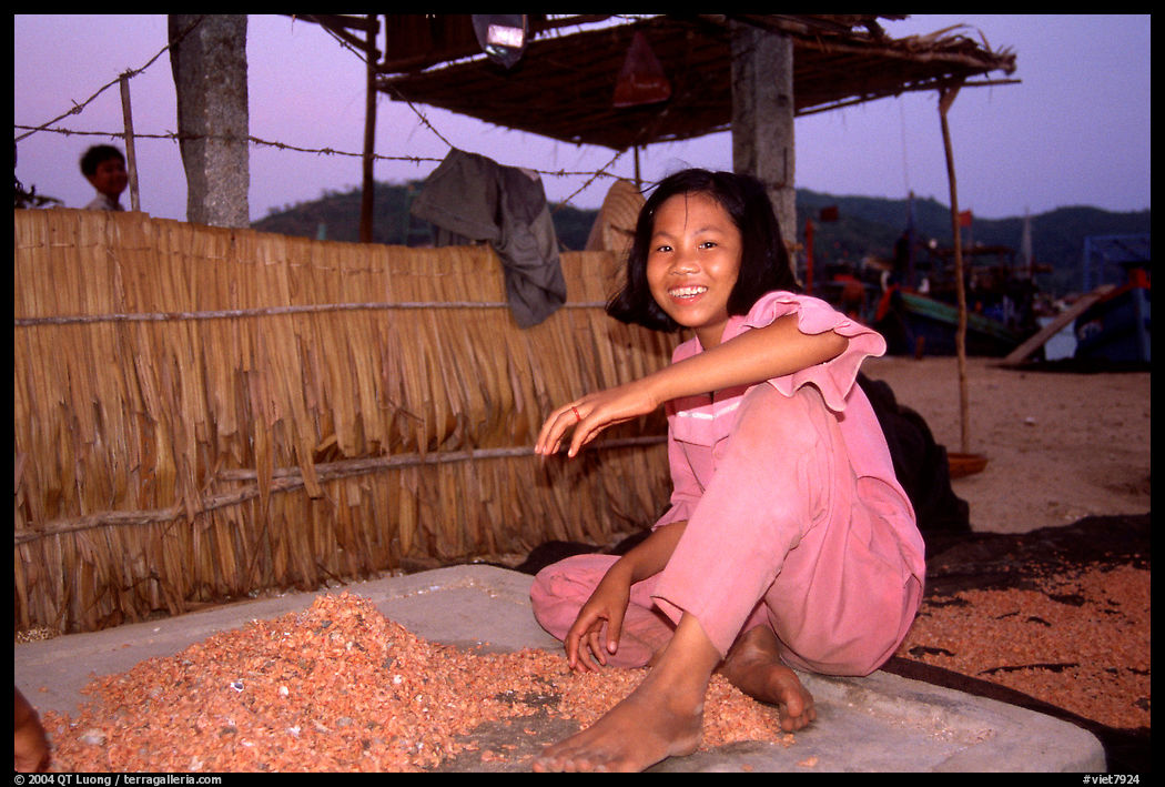 Girl drying shrimp. Ha Tien, Vietnam