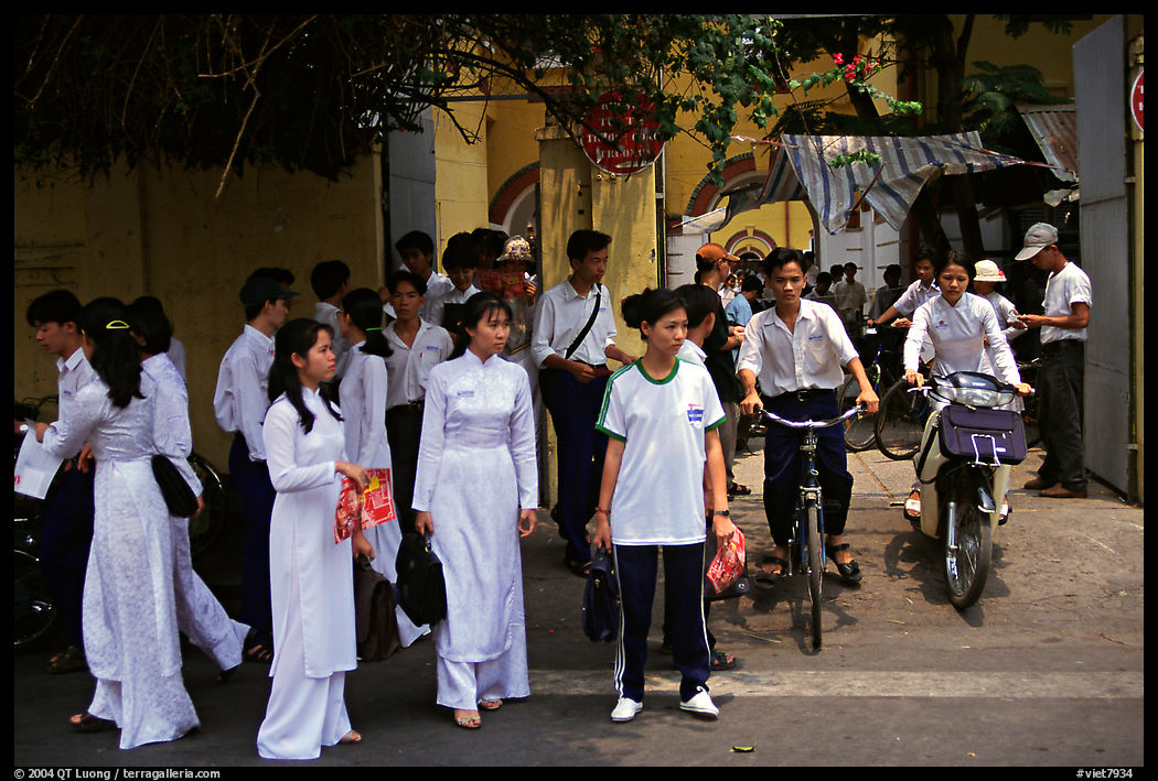Uniformed school children exit their school. Ho Chi Minh City, Vietnam