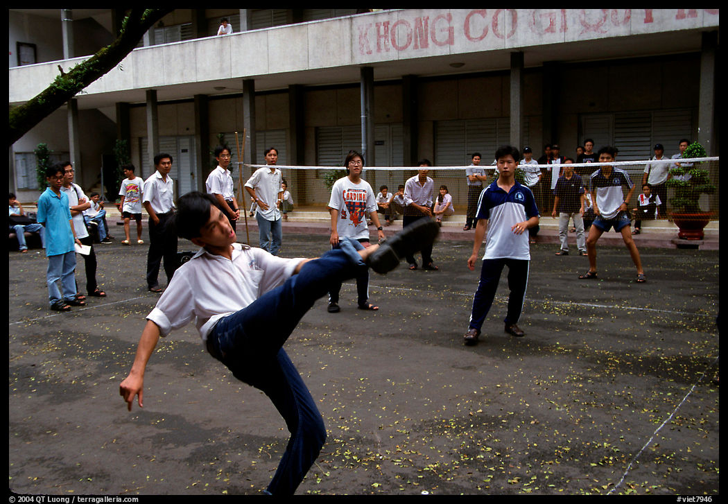 Students playing foot-only volley-ball in a school courtyard. Ho Chi Minh City, Vietnam