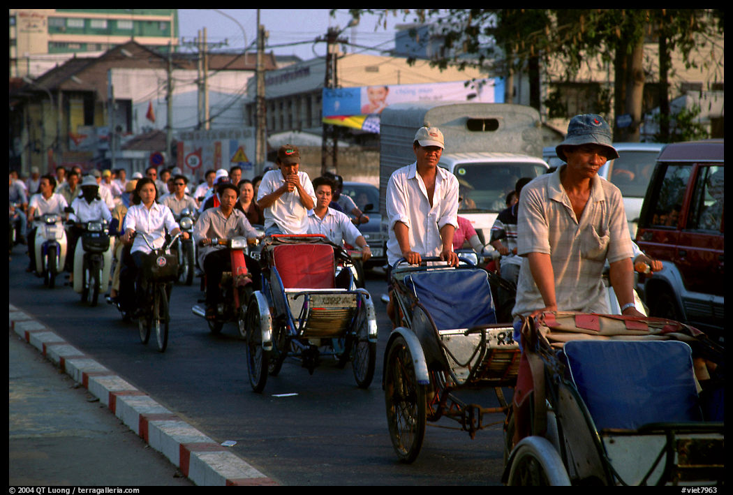 Cyclos and morning traffic. Ho Chi Minh City, Vietnam