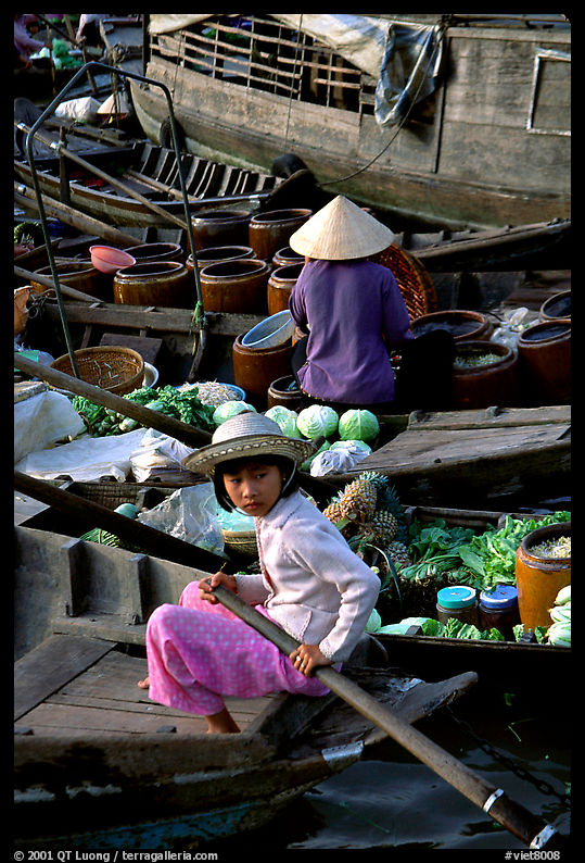 Child at Phung Hiep floating market. Can Tho, Vietnam