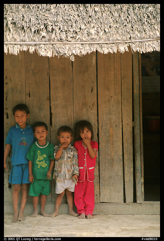 Children in front of rural hut, Hon Chong. Vietnam