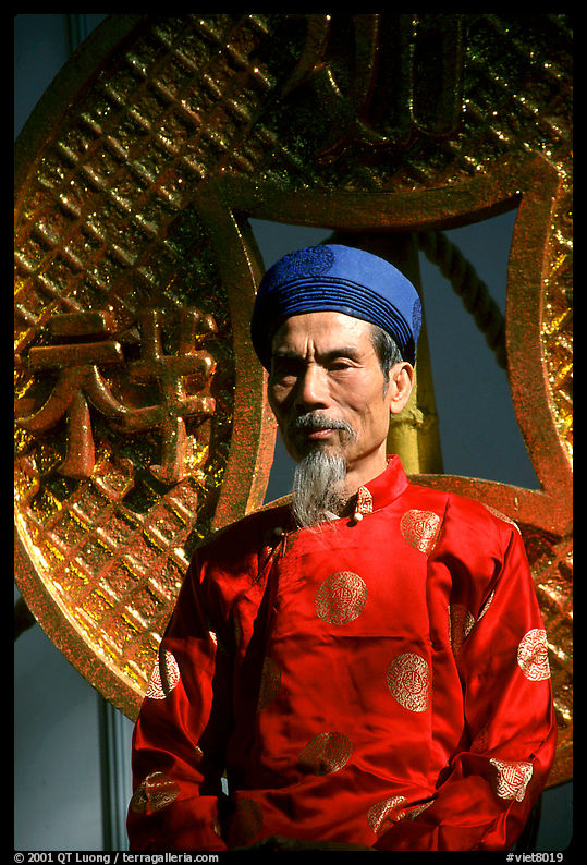 Elderly man in Ao Dai costume, a vanishing tradition. Ho Chi Minh City, Vietnam