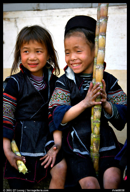 Black Hmong girls, with their daily fix of sugar cane, Sapa. Vietnam