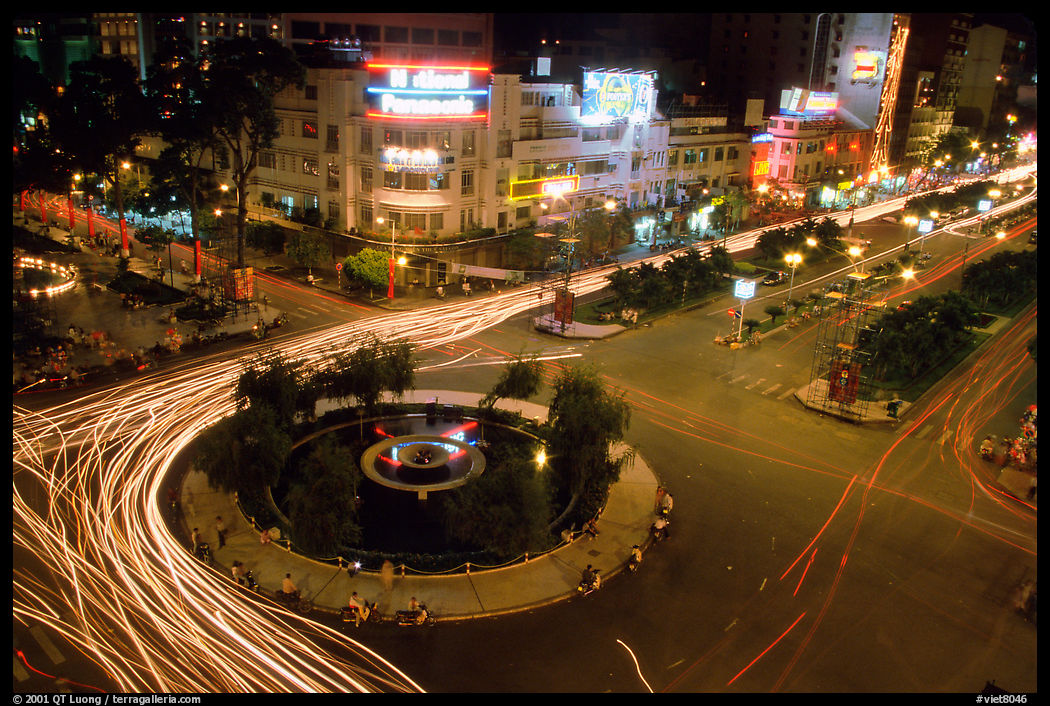 Traffic: at the heart of the city, intersection of Le Loi and Nguyen Hue boulevards at night. Ho Chi Minh City, Vietnam