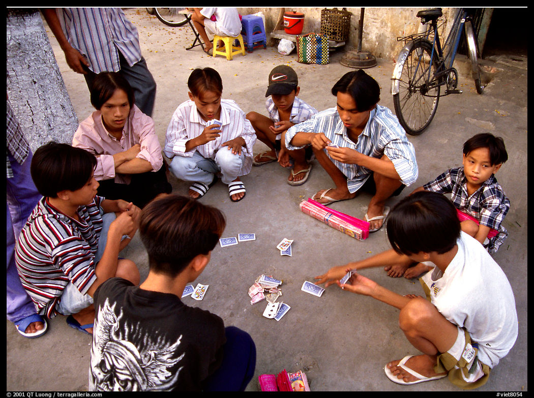 Children playing cards. Ho Chi Minh City, Vietnam