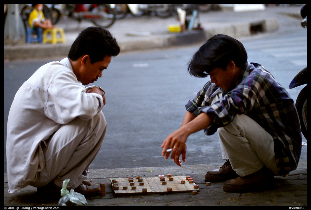 Chinese Chess game. Vietnamese people can sit on their heels for hours. Ho Chi Minh City, Vietnam