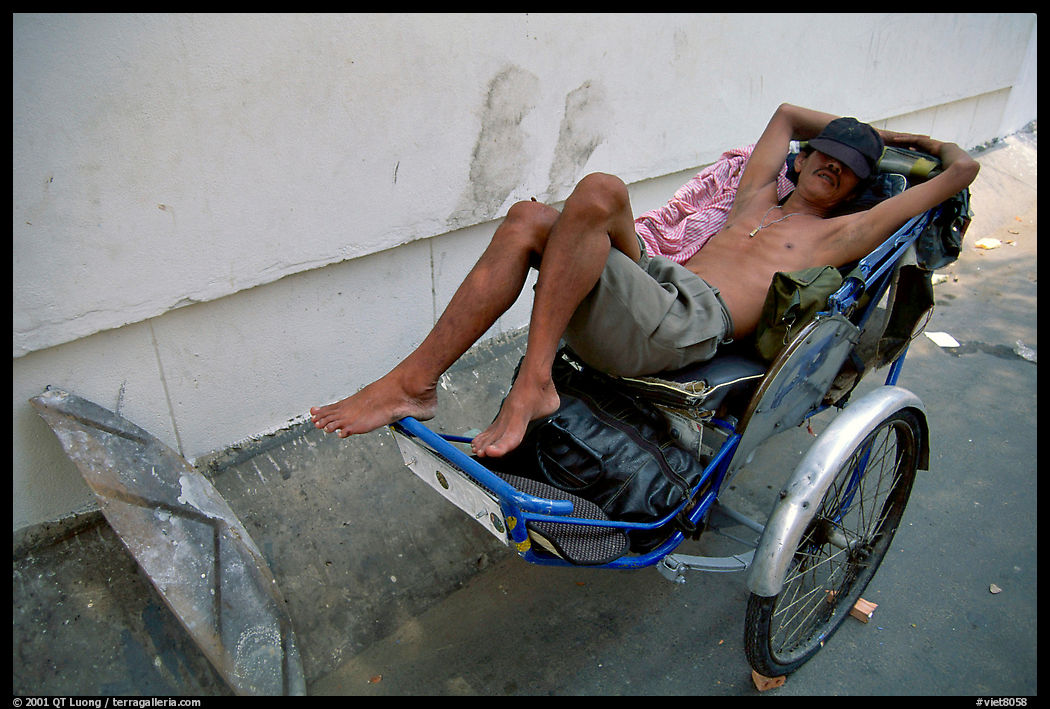 Cyclo driver taking an afternoon nap. Ho Chi Minh City, Vietnam