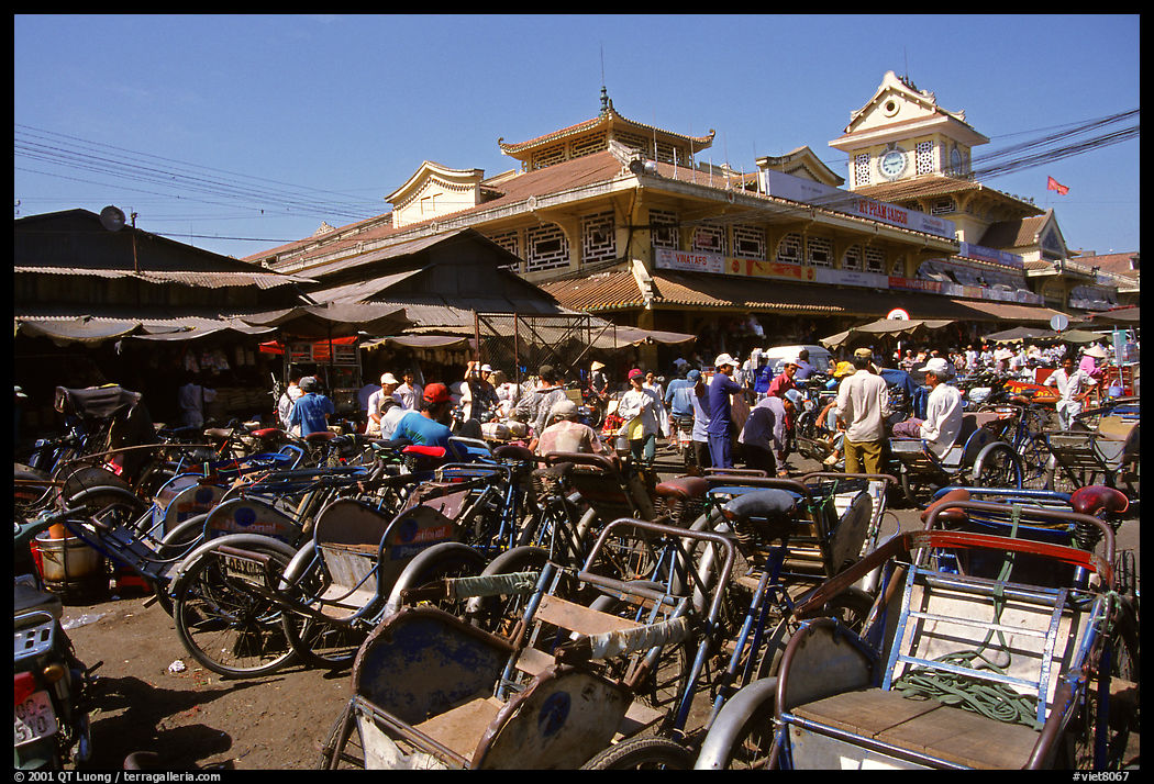 Cyclos wait outside the Bin Tay market in Cholon, the Ethnic-chinese vibrant business district whose name means Big Market. Ho Chi Minh City , Vietnam