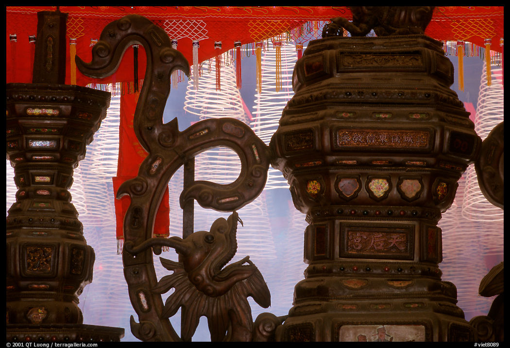 Red color is believed to be lucky. Urn and incense coils, Cho Lon. Ho Chi Minh City, Vietnam