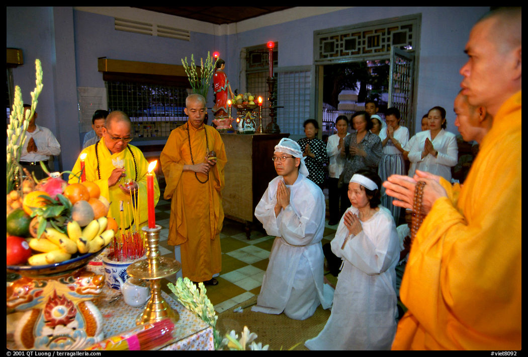 Buddhist funeral ceremony. Note that white is the color used for mourning. Ho Chi Minh City, Vietnam