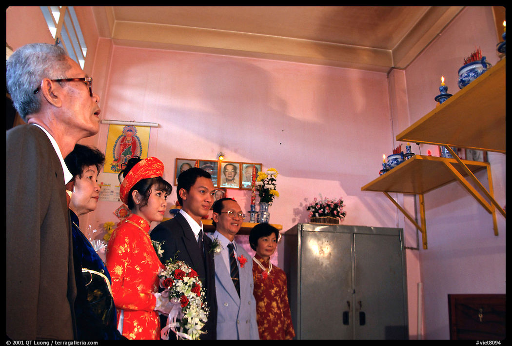 The bride is presented to the groom's ancestors in the presence of both parents during a wedding. Ho Chi Minh City, Vietnam
