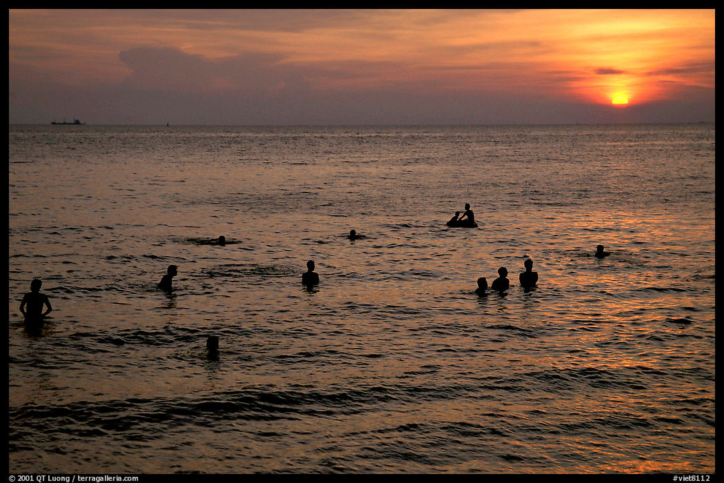 Soaking in the warm China sea at sunset. Vung Tau, Vietnam