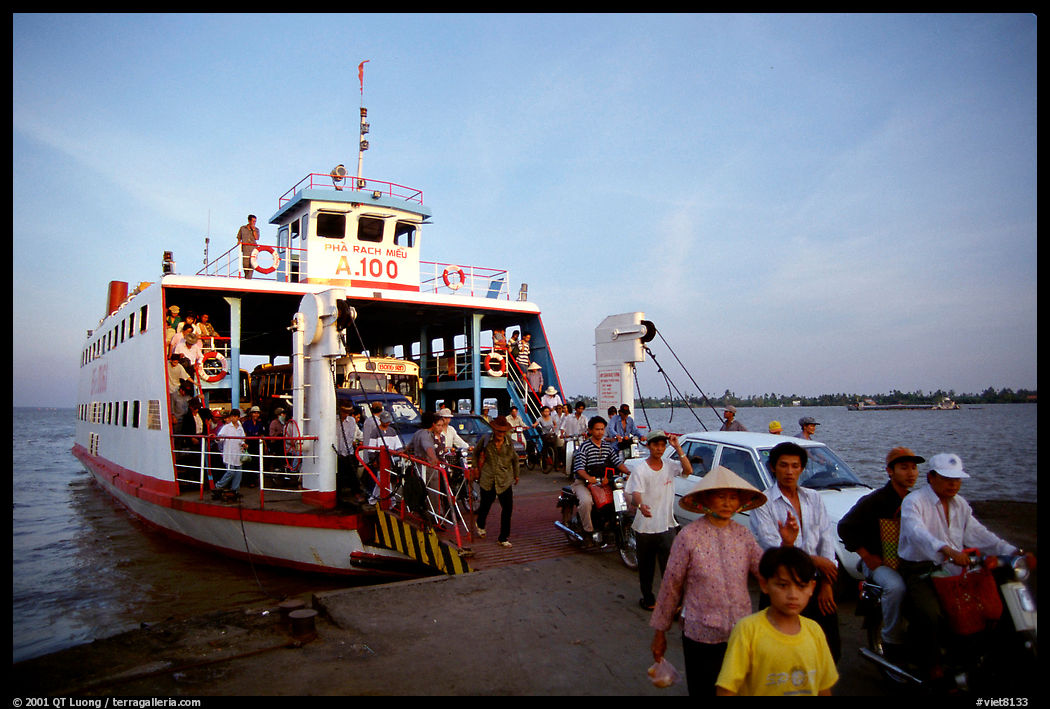 Disembarking from a ferry on one of the many arms of the Mekong, My Tho. Mekong Delta region, Vietnam