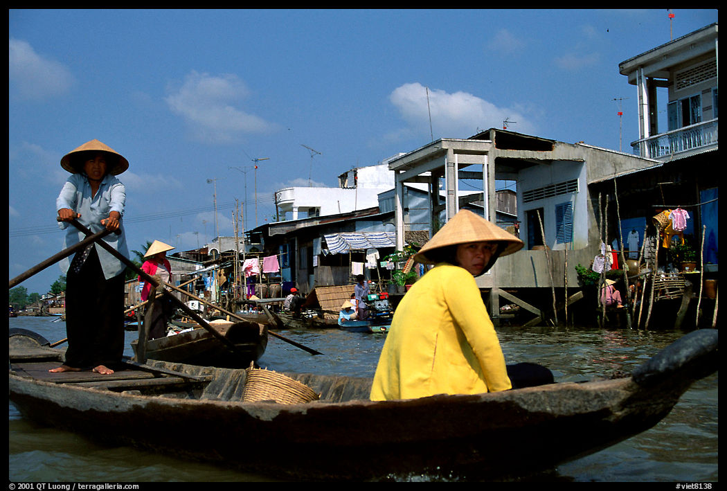 The river at the back of townhouses is more often used than the road at the front.  Phung Hiep. Can Tho, Vietnam