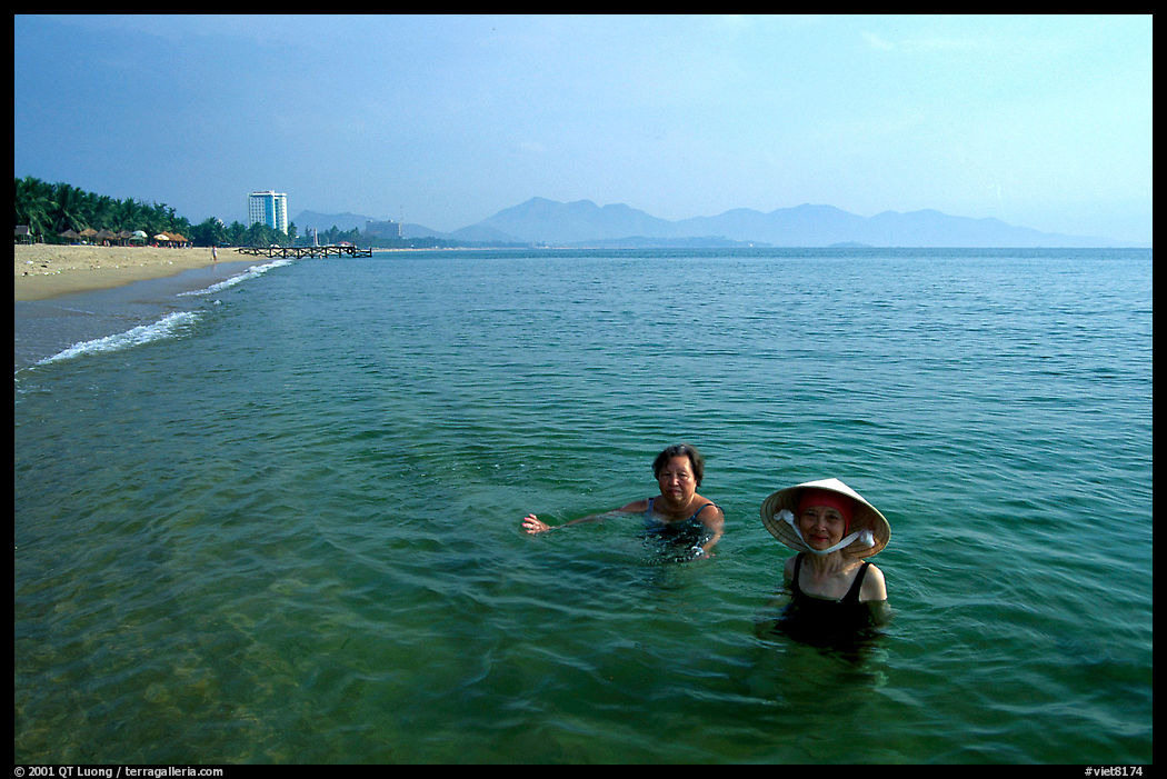 Early morning bath on a perfect beach Nha Trang. Vietnam