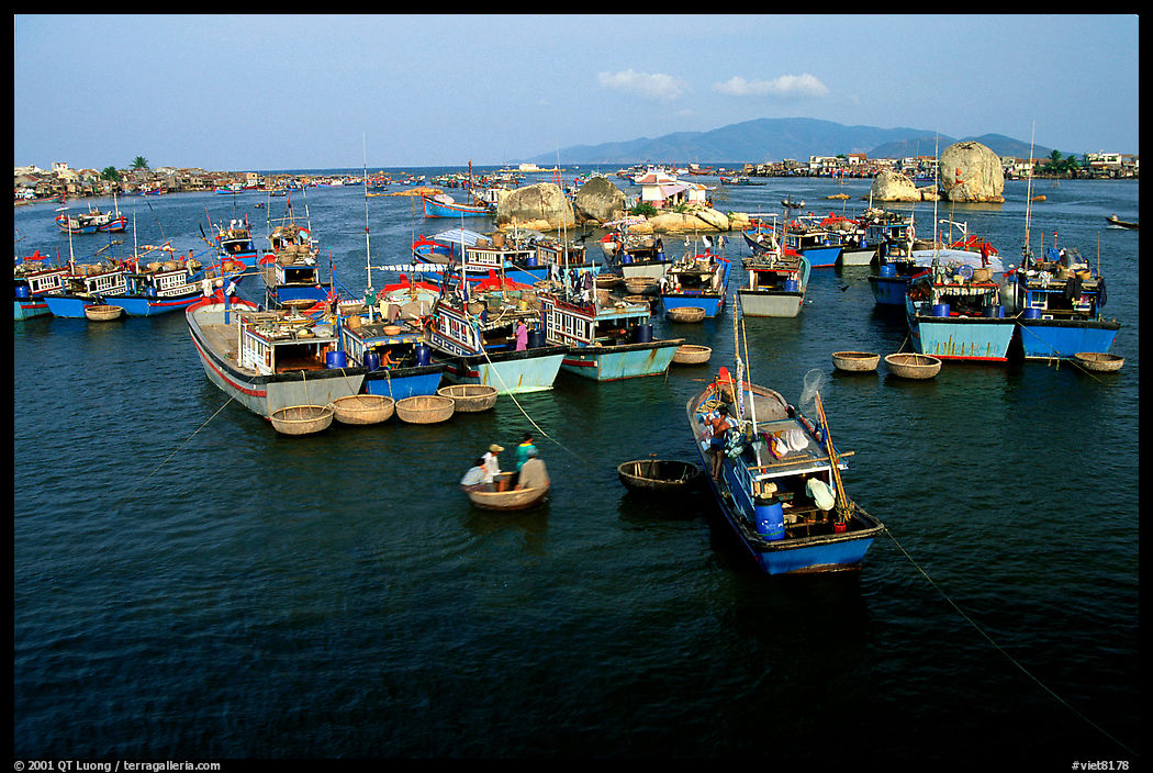 Colorfull fishing boats. Note the circular basket boats used to get to shore.  Nha Trang. Vietnam