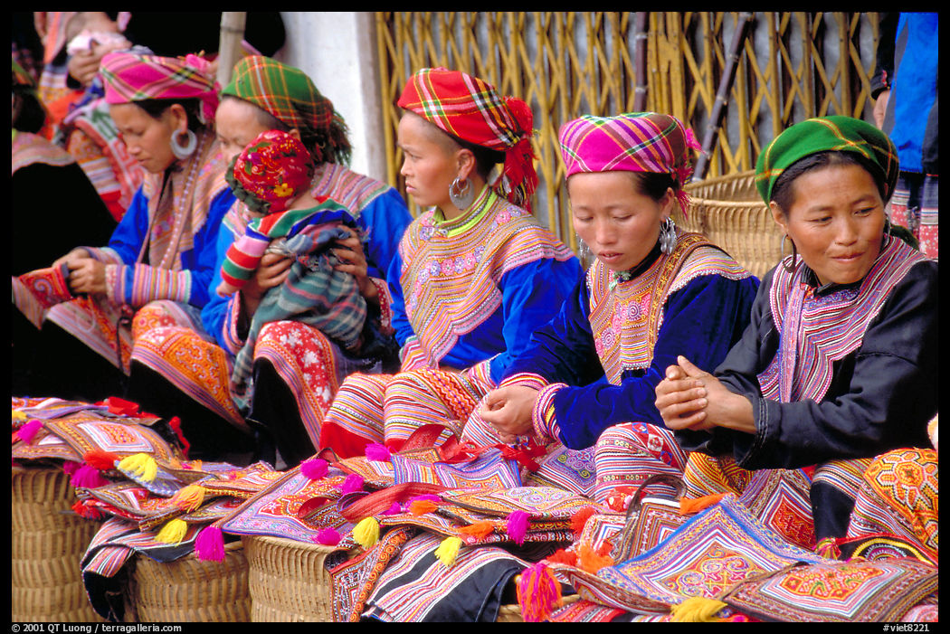 Women sell the colorful garnments after which the Flower Hmong are named. Bac Ha, Vietnam