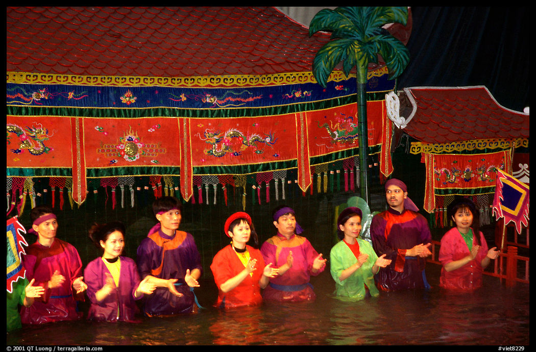 Artists salute after a water puppets performance. Hanoi, Vietnam