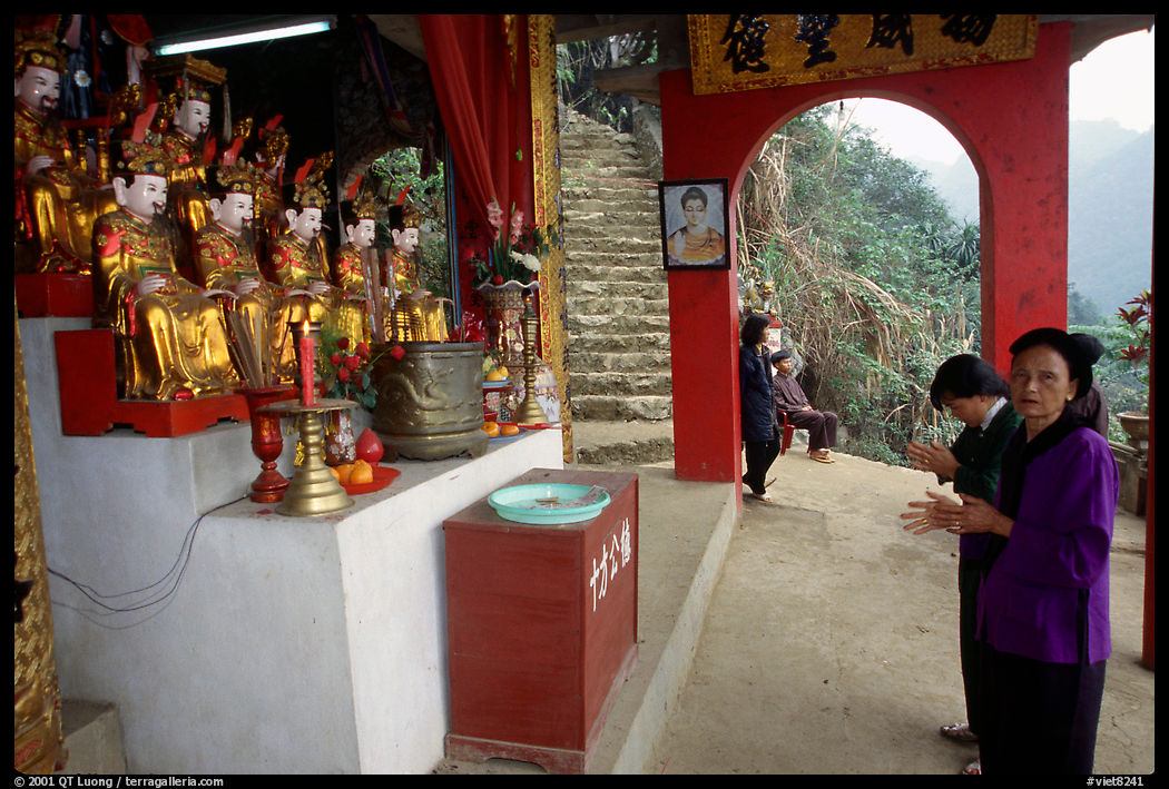 Praying at an outdoor temple. Perfume Pagoda near Hanoi, Vietnam