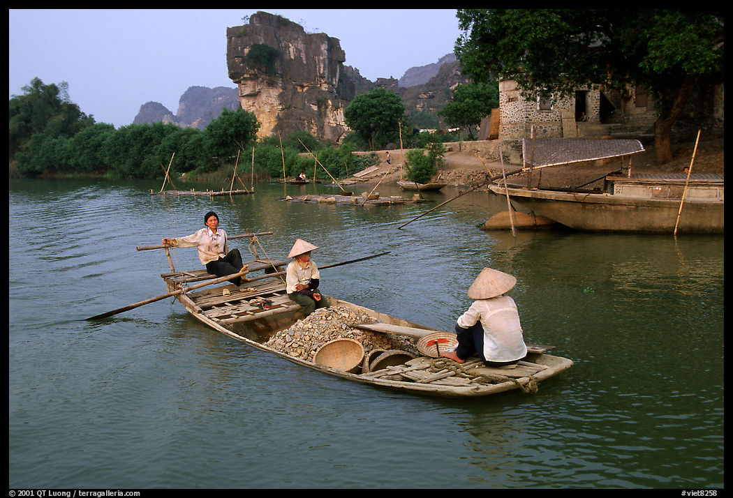 Villagers transport stones from the quary on Ken Ga canal. near Ninh Binh,  Vietnam
