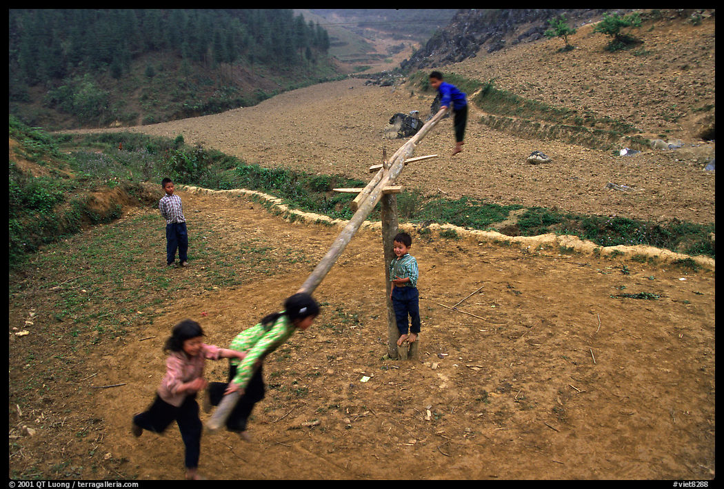 Children playing a rotating swing near Can Cau. Vietnam