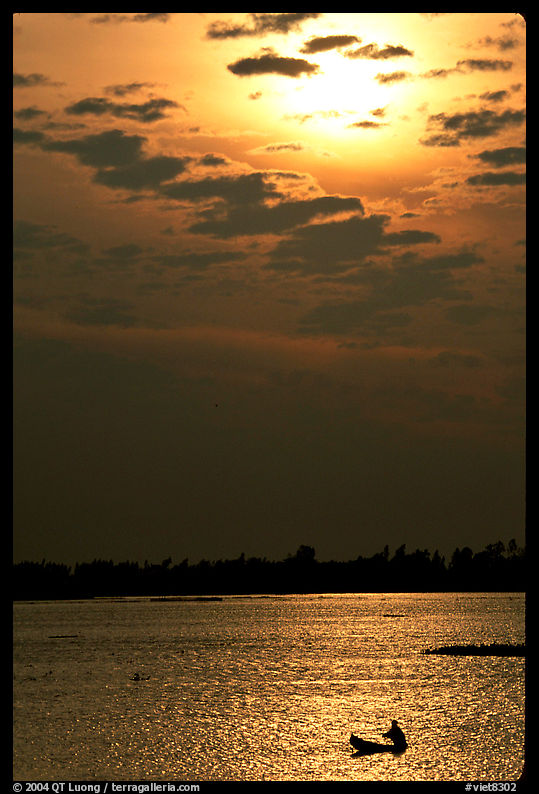 Small boat at sunrise. Chau Doc, Vietnam