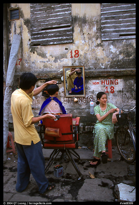 Hairdressing in the street. Ho Chi Minh City, Vietnam