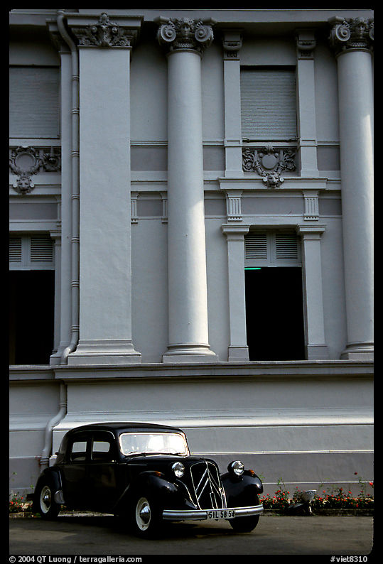 Classic Citroen car in front of a palace. Ho Chi Minh City, Vietnam