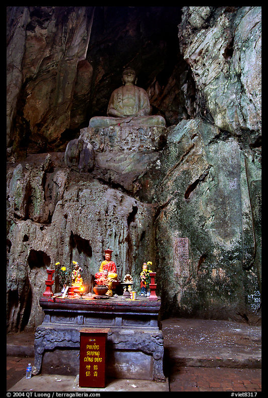 Altar and Buddha statue in a troglodyte sanctuary of the Marble Mountains, Da Nang. Vietnam