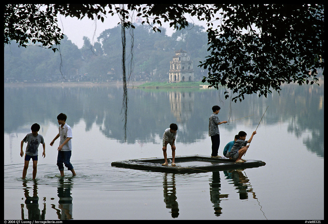 Children playing in Hoa Kiem Lake. Hanoi, Vietnam