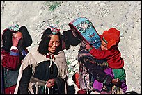 Elderly women with turquoise-covered head adornments, Zanskar, Jammu and Kashmir. India