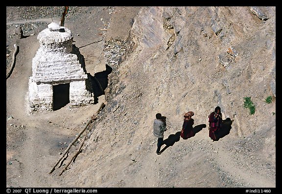 People ascending a trail past a chorten below Phuktal,  Zanskar, Jammu and Kashmir. India