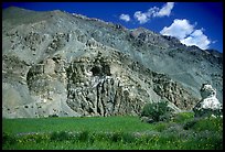 Cultivated fields, chorten, and Phuktal monastery, Zanskar, Jammu and Kashmir. India (color)