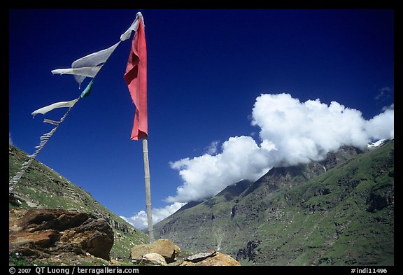 Prayer flag and cloud-capped peak, Himachal Pradesh. India