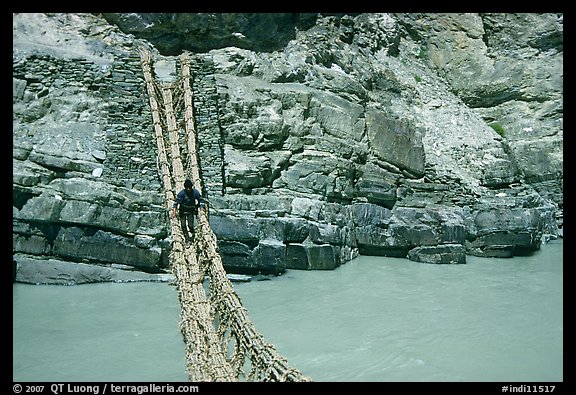 Man crossing a river by rope bridge, Zanskar, Jammu and Kashmir. India (color)