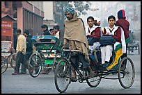 Cycle-rickshaw carrying uniformed schoolgirls. New Delhi, India ( color)