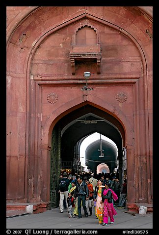 People walking out of the Covered Bazar, Red Fort. New Delhi, India (color)