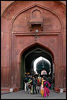 People walking out of the Covered Bazar, Red Fort. New Delhi, India ( color)