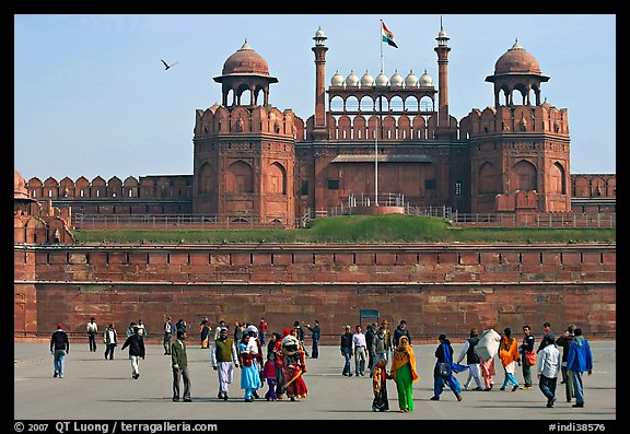 Tourists walking on esplanade in front of the Lahore Gate. New Delhi, India