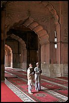 Two muslem men in Jama Masjid mosque prayer hall. New Delhi, India (color)