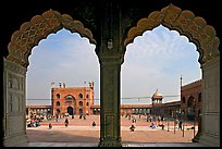 Courtyard of mosque seen through arches of prayer hall, Jama Masjid. New Delhi, India (color)