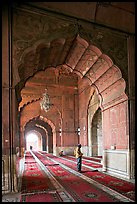 Muslim man in prayer, prayer hall, Jama Masjid. New Delhi, India (color)